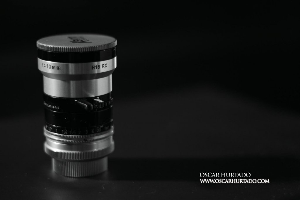 Kern Switar 10mm f1.6 preset C-mount lens standing on rear cap