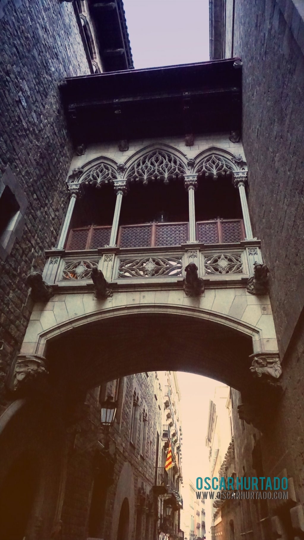 The iconic skybridge found in Carrer del Bisbe street in the Gothic Quarter of Barcelona Spain