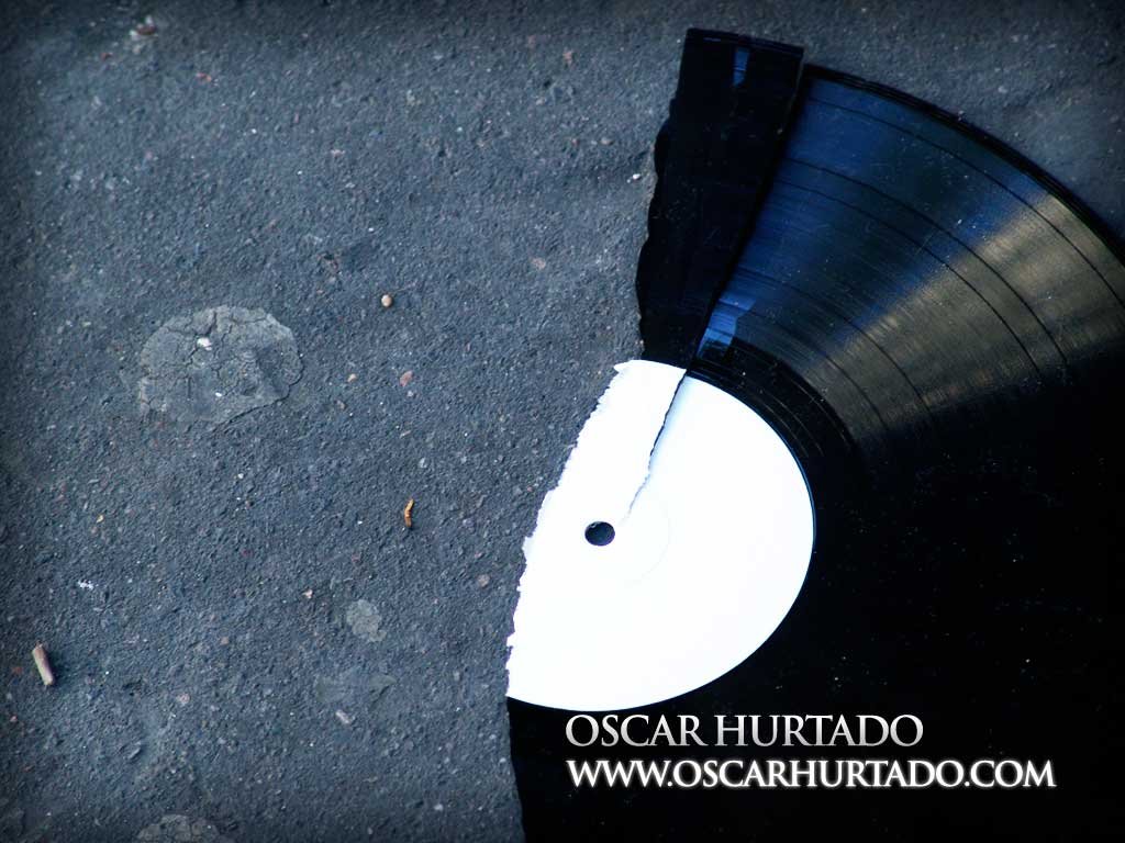 Piece of a broken vinyl record found abandoned in the streets of Paris