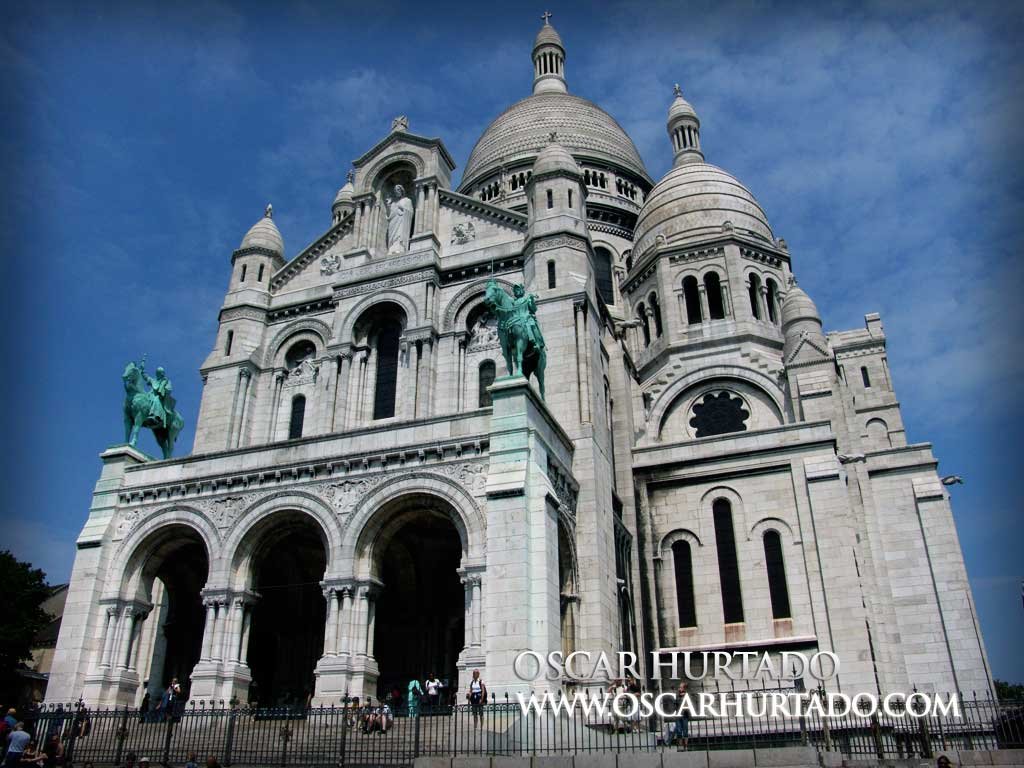 Semi frontal view of the iconic Basilica of the Sacré-Coeur of Montmartre during one summer afternoon