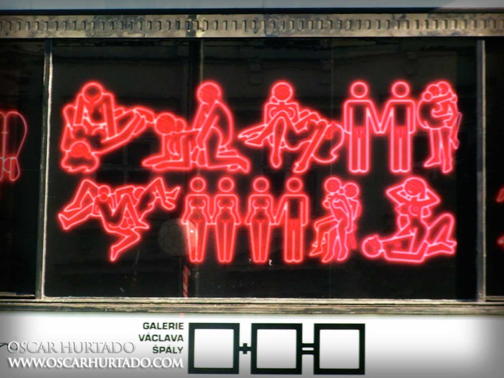 The neon red Main Panel of a Sex Exhibition taking place in Národní­ street at the Václav Špála Gallery