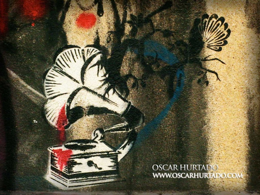 Black and red graffiti depicting a gramophone with blood coming out and dripping over the turntable