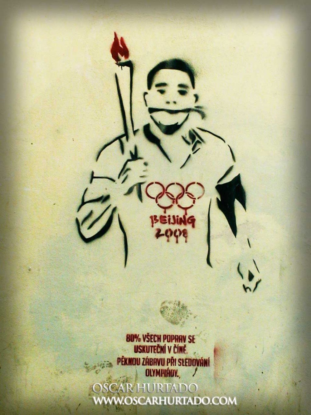 Black and red graffiti of an Olympic athlete with the Beijing 2008 logo bleeding on his chest due to human rights abuses during the preparations for the games