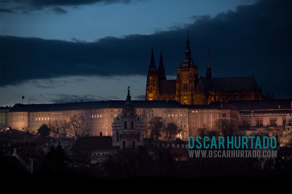 View from a distance of the impressive Prague Castle and surrounding buildings during a winter evening