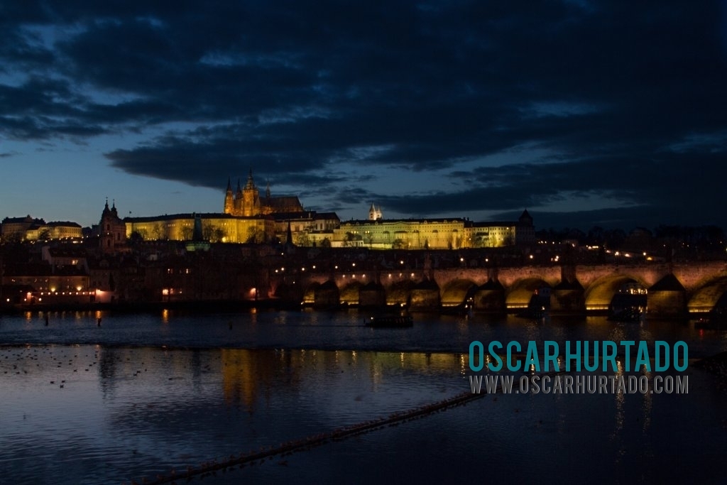 View from a distance of Charles Bridge and the Prague Castle during one winter evening