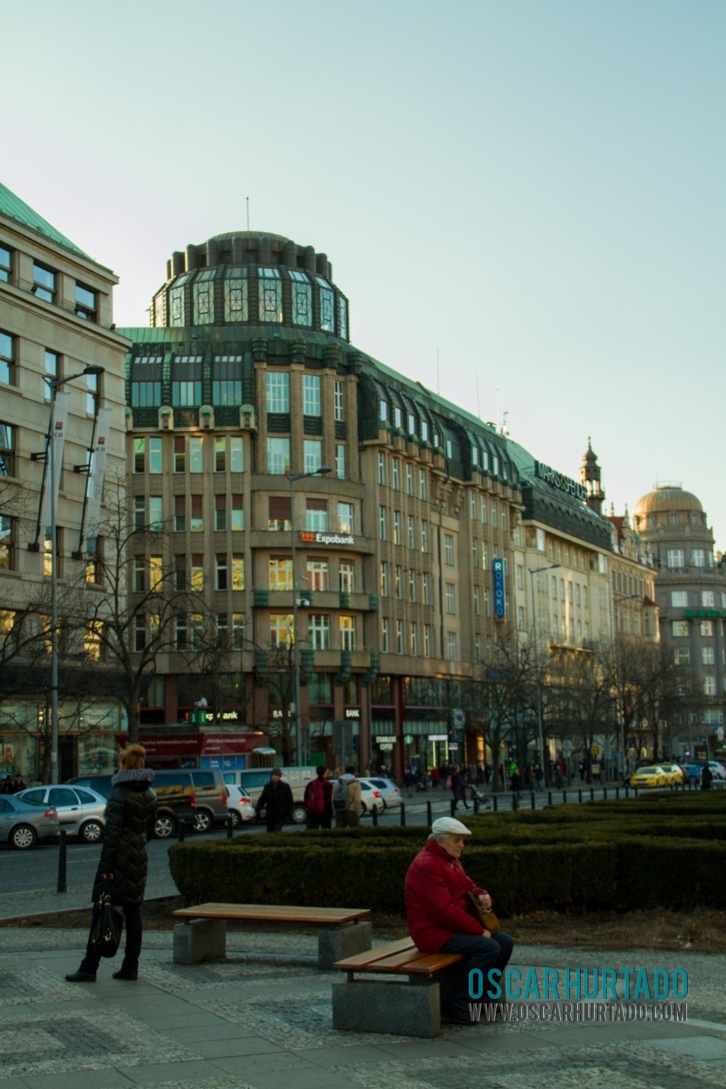 A young woman and an old man peacefully await for something in Wenceslas Square