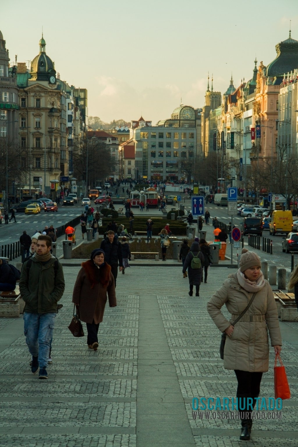 View of Wenceslas Square full of pedestrians busily walking by