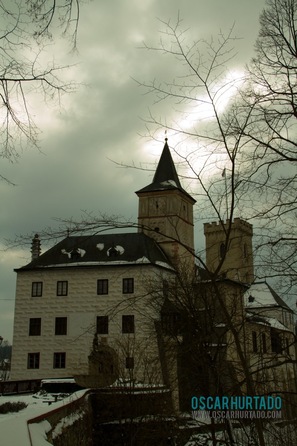 A lateral view of the Rožmberk Castle during a winter afternoon