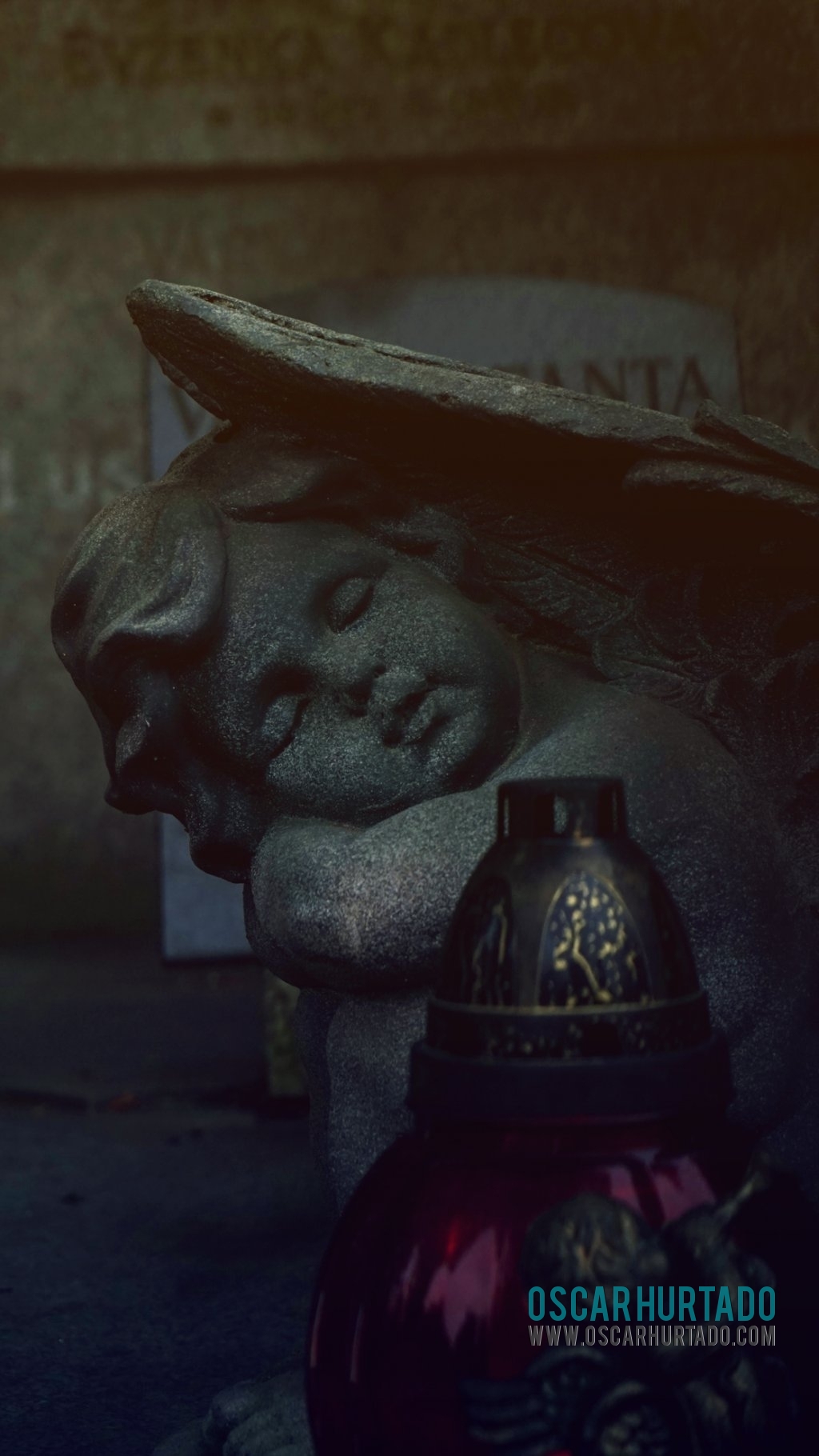Detail view of a beautiful statue portraying a little angel sleeping over a grave in Vyšehrad