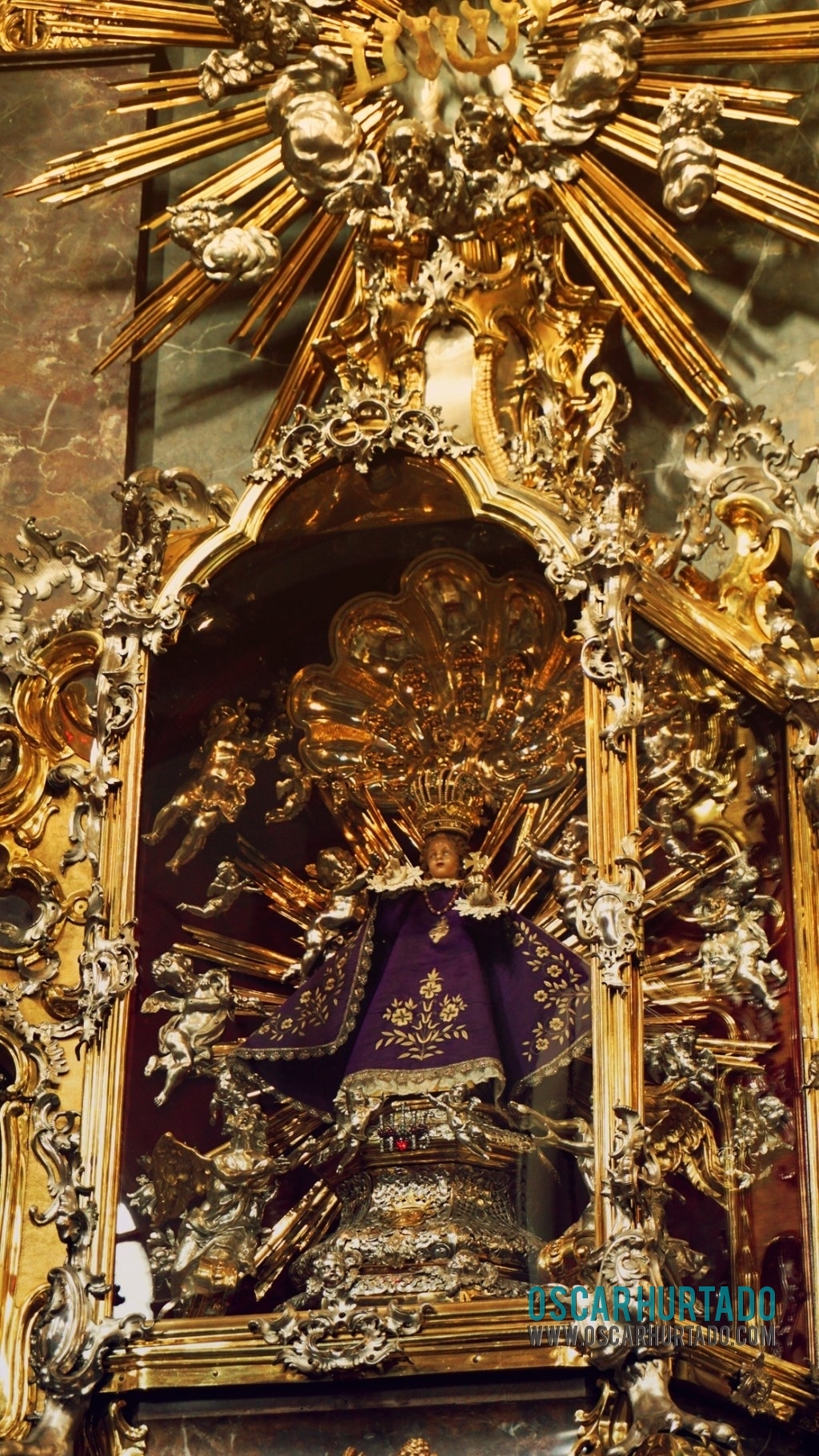 Detail view of the iconic and worshipped Infant Jesus of Prague in his lent outfit