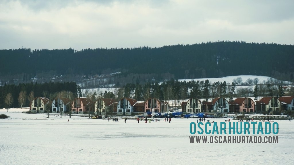 A series of colorful holiday homes located on the shores of the Lipno lake