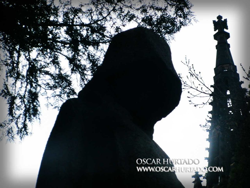 Contrasty shot of the dark silhouette of a statue from the Vyšehrad cemetery