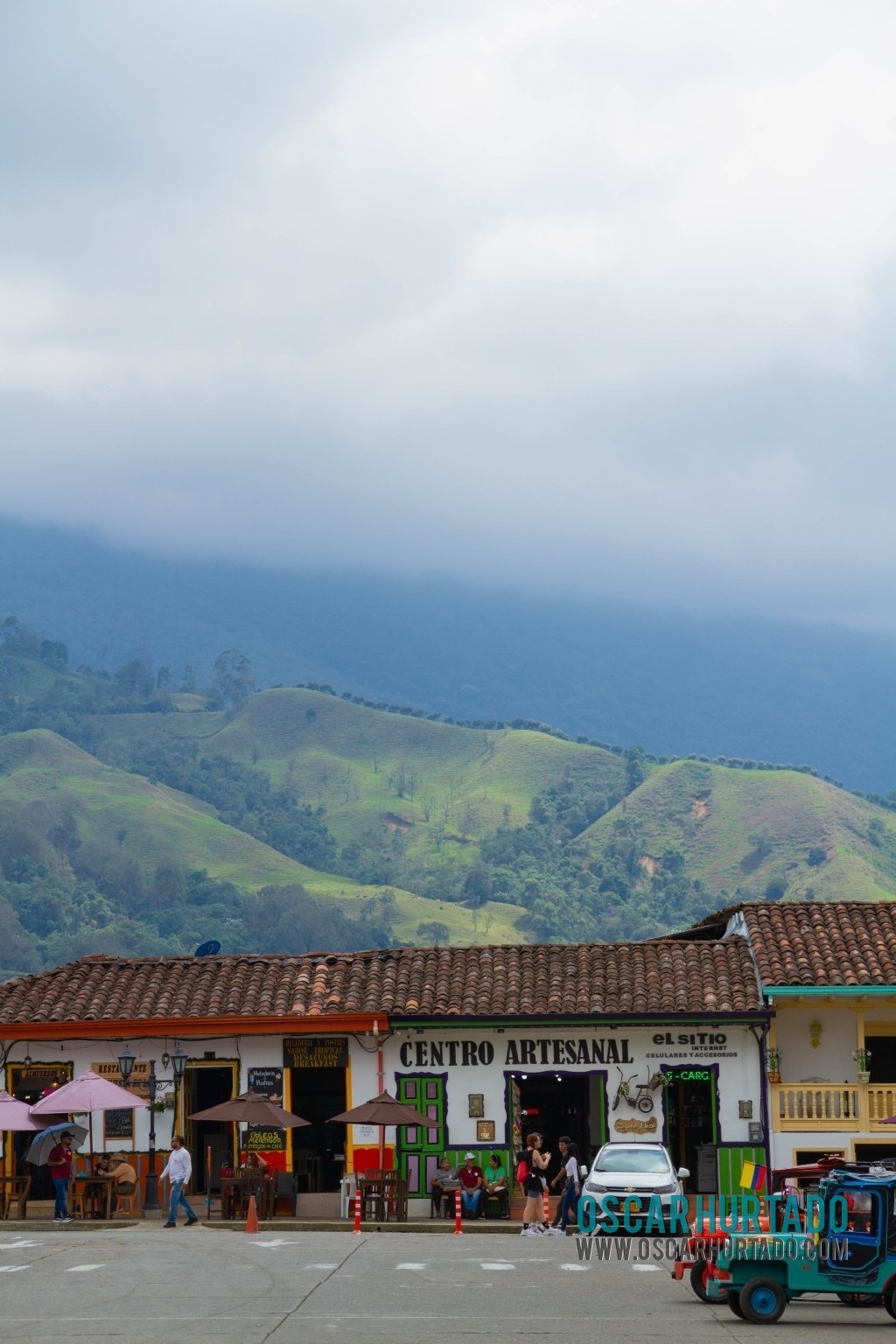The iconic artisanal center contrasting with the beautiful coffee region landscape