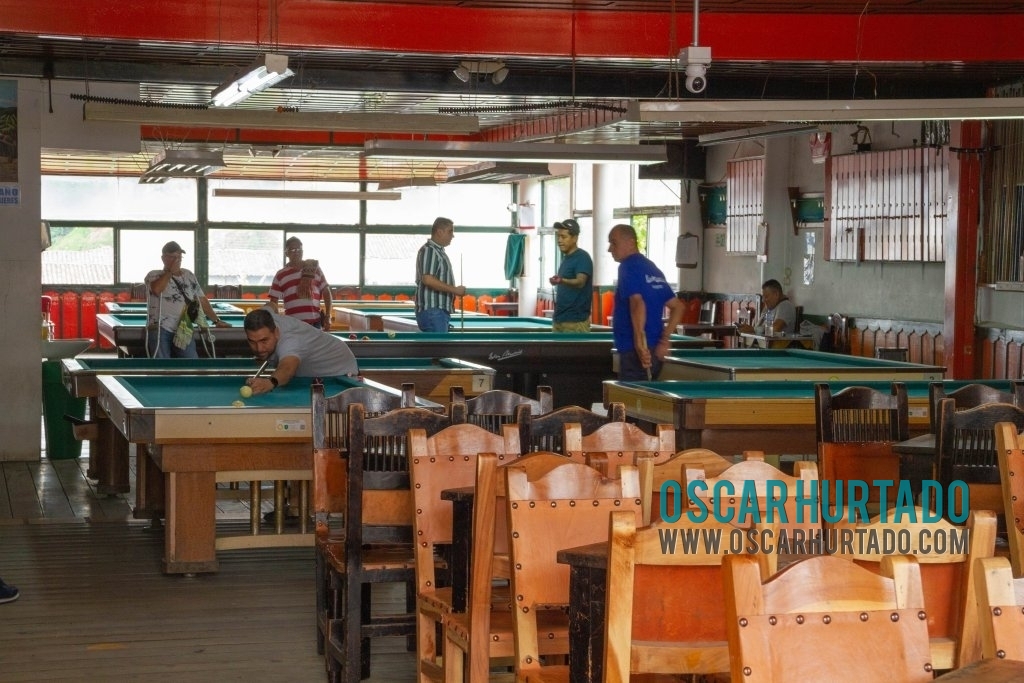 Men enjoying their game of pool during one fine afternoon in Salento, Quindío